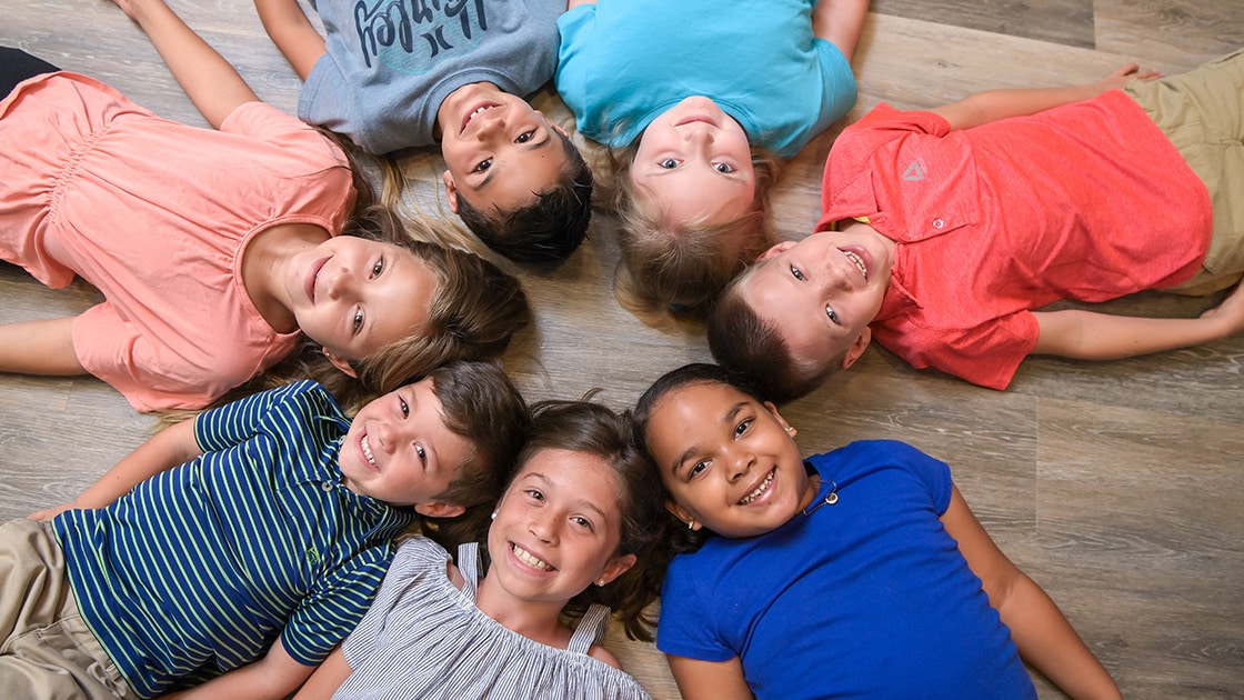 children in a group on the floor