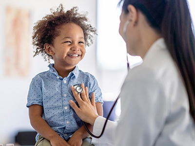 Smiling Child with Doctor